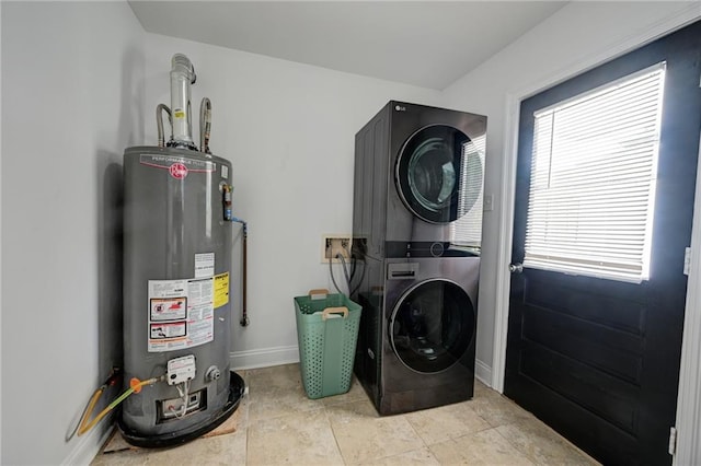 4043 S Inwood Ave, New Orleans, LA 70131 - washroom featuring gas water heater, estacked washer and dryer, and plenty of natural light