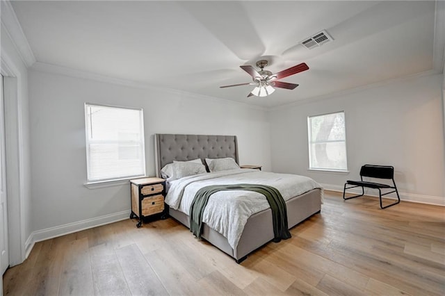 4043 S Inwood Ave, New Orleans, LA 70131 - bedroom with crown molding, multiple windows, light wood-type flooring, and ceiling fan