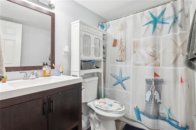 112224 N Johnson St, New Orleans, LA 70116 - full bathroom featuring vanity and a shower with shower curtain
