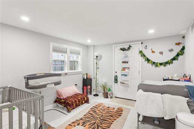 112224 N Johnson St, New Orleans, LA 70116 - bedroom with recessed lighting and a crib