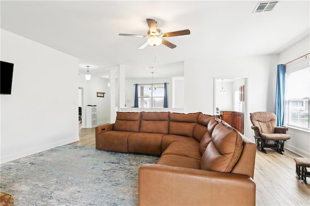 5233 Savannah Ln, Marrero, LA 70072 - living room with wood finished floors, healthy amount of natural light, and a ceiling fan