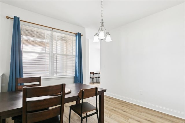 5233 Savannah Ln, Marrero, LA 70072 - dining space with a chandelier and light wood-style flooring