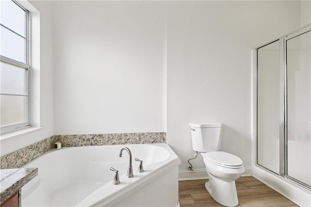 5233 Savannah Ln, Marrero, LA 70072 - bathroom with a garden tub, a stall shower, vanity, and wood finished floors