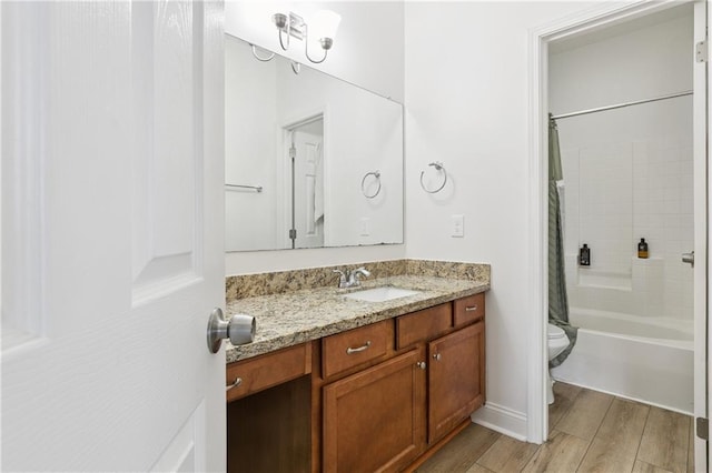 5233 Savannah Ln, Marrero, LA 70072 - bathroom featuring vanity, shower / tub combo with curtain, and wood finished floors