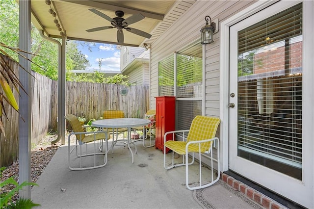 158 Emerald Oaks Dr, Covington, LA 70433 - fenced backyard featuring outdoor dining area, a ceiling fan, and a patio area
