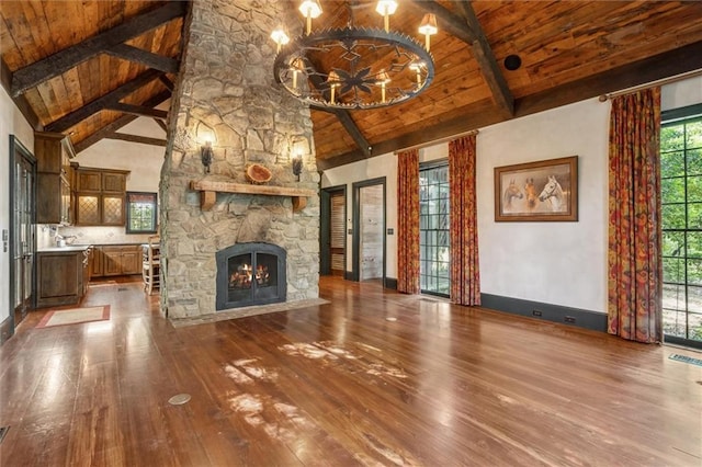 266 Wpa Rd, Ms, MS 39459 - unfurnished living room featuring a wooden ceiling with exposed beams, hardwood / wood-style floors, a fireplace, and high vaulted ceiling
