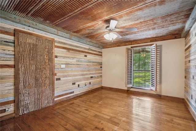 266 Wpa Rd, Ms, MS 39459 - spare room featuring wooden ceiling, wooden walls, hardwood / wood-style floors, and ceiling fan
