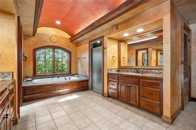 266 Wpa Rd, Ms, MS 39459 - bathroom featuring vaulted ceiling, vanity, a bath, recessed lighting, and tile patterned floors