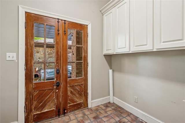 266 Wpa Rd, Ms, MS 39459 - doorway with baseboards and brick flooring