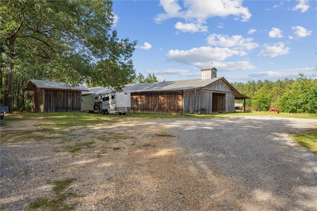 266 Wpa Rd, Ms, MS 39459 - exterior space featuring an outbuilding, an outdoor structure, and driveway