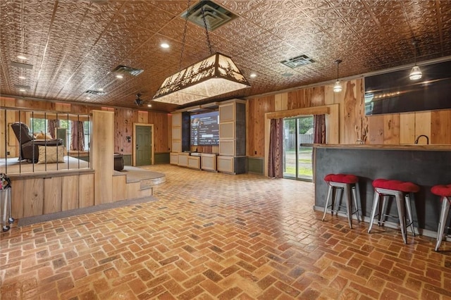 266 Wpa Rd, Ms, MS 39459 - kitchen featuring wood walls, an ornate ceiling, and open floor plan