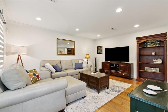 1213 Haring Rd, Metairie, LA 70001 - living area with light wood-type flooring, recessed lighting, and ornamental molding