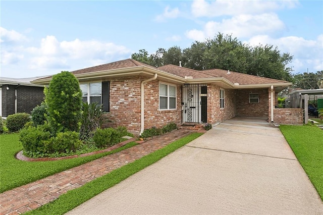 1139 Nursery Ave, Metairie, LA 70005 - single story home featuring driveway, brick siding, a carport, and a front lawn