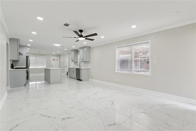 1139 Nursery Ave, Metairie, LA 70005 - unfurnished living room with ornamental molding, recessed lighting, ceiling fan, and light marble finish floors