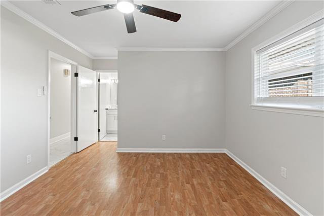 1139 Nursery Ave, Metairie, LA 70005 - unfurnished bedroom with light wood finished floors, crown molding, ensuite bath, and a ceiling fan