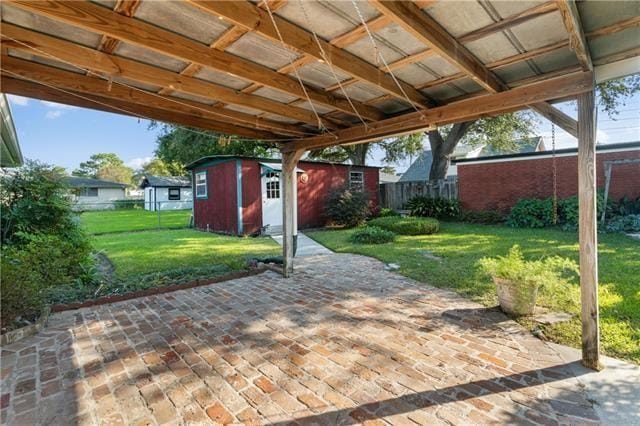 1139 Nursery Ave, Metairie, LA 70005 - view of patio / terrace featuring a storage unit