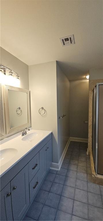 2641 Long Branch Dr, Marrero, LA 70072 - bathroom with double vanity, tile patterned floors, and a stall shower