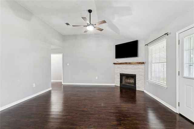 834 Mongrue St, Luling, LA 70070 - unfurnished living room featuring lofted ceiling, a ceiling fan, wood finished floors, and a stone fireplace