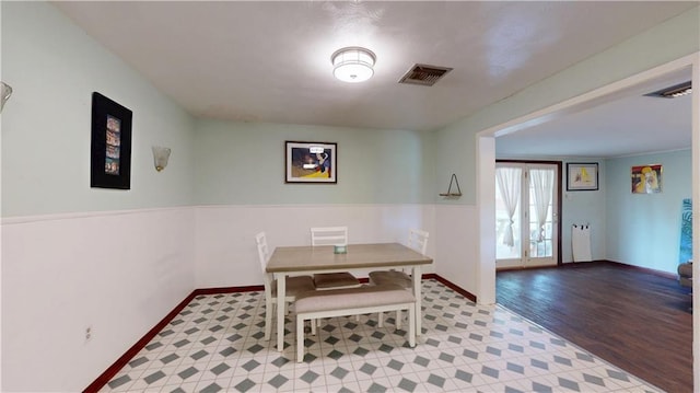 1128 N Upland Ave, Metairie, LA 70003 - dining room with baseboards and wood finished floors