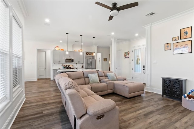218 Belle Ormond Cir, Destrehan, LA 70047 - living room with ceiling fan, ornate columns, dark wood-style floors, ornamental molding, and recessed lighting