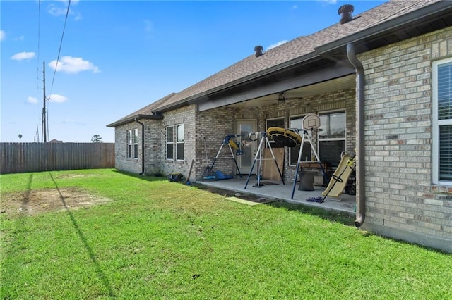 218 Belle Ormond Cir, Destrehan, LA 70047 - back of house featuring a patio area, brick siding, and a shingled roof