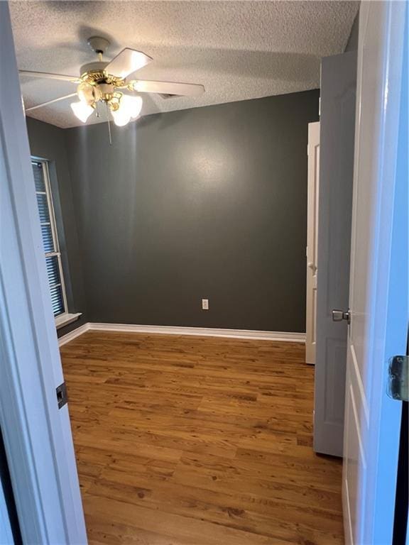 2712 Bayou Bleu Dr, Marrero, LA 70072 - empty room featuring wood finished floors, a textured ceiling, and ceiling fan