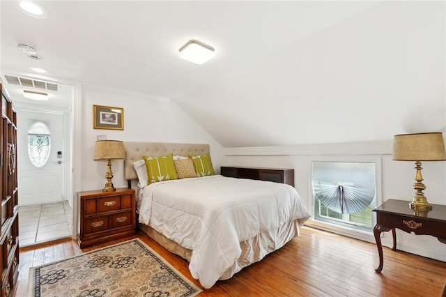 1801 Adams St, New Orleans, LA 70118 - bedroom featuring wood-type flooring, vaulted ceiling, and recessed lighting