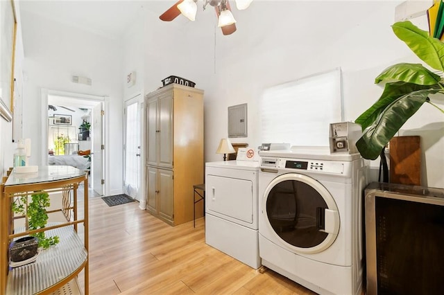 1801 Adams St, New Orleans, LA 70118 - washroom featuring separate washer and dryer, electric panel, light wood-type flooring, a ceiling fan, and a high ceiling
