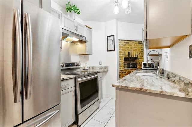 1801 Adams St, New Orleans, LA 70118 - kitchen featuring stainless steel appliances, under cabinet range hood, light marble finish flooring, and light stone counters
