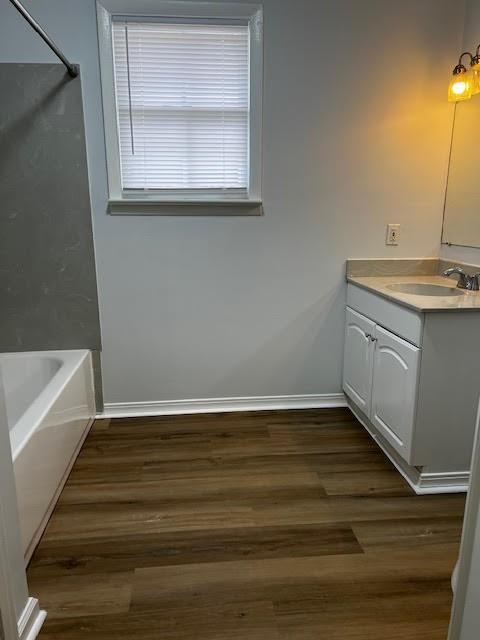 479 Grefer Ave, Harvey, LA 70058 - full bathroom featuring vanity, wood finished floors, and shower / bathtub combination