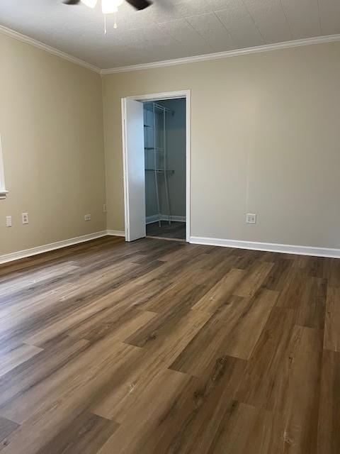 479 Grefer Ave, Harvey, LA 70058 - empty room featuring ceiling fan, dark wood-style floors, and ornamental molding