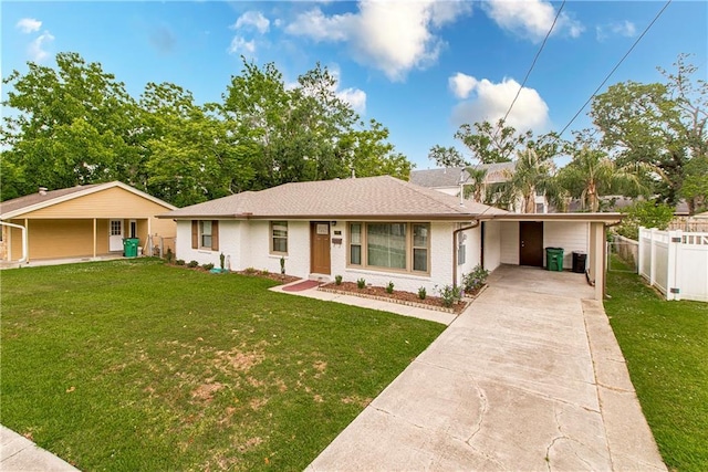 137 Diane Ave, River Ridge, LA 70123 - ranch-style house featuring concrete driveway, an attached carport, and brick siding
