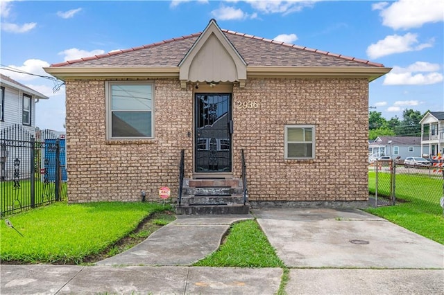 2936 General Ogden St, New Orleans, LA 70118 - view of front of home with a shingled roof and brick siding