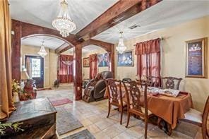 2936 General Ogden St, New Orleans, LA 70118 - dining space with arched walkways, a chandelier, and beamed ceiling