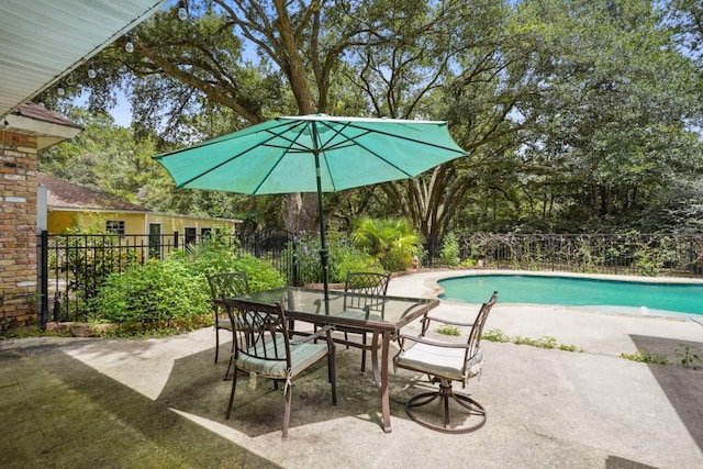 16233 Cody Ln, Covington, LA 70435 - view of swimming pool with a patio, outdoor dining area, and view of scattered trees