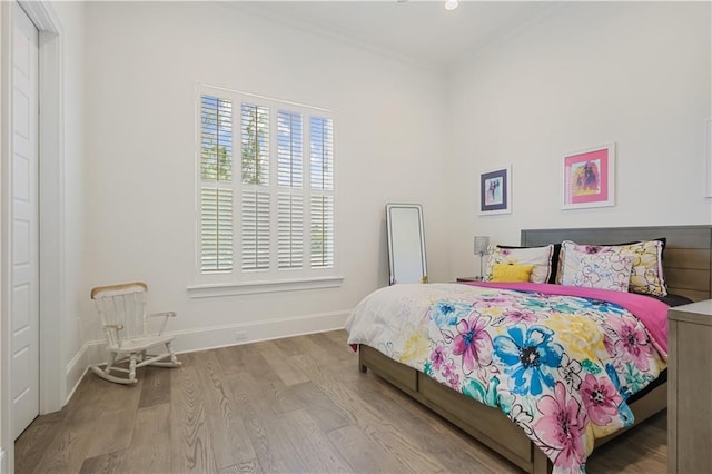 128 Juniper Ct, Mandeville, LA 70471 - bedroom featuring wood finished floors and ornamental molding