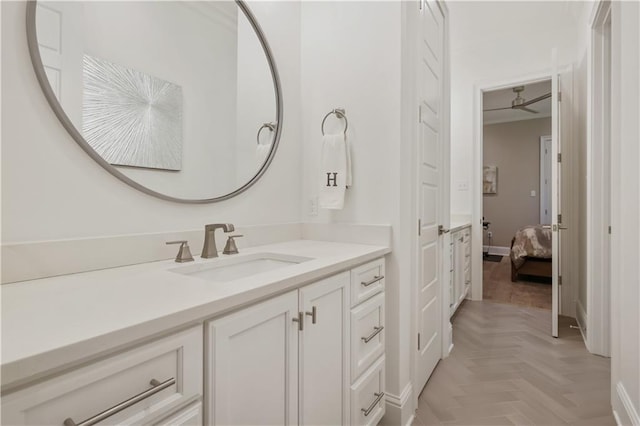 128 Juniper Ct, Mandeville, LA 70471 - bathroom with vanity, connected bathroom, and ceiling fan