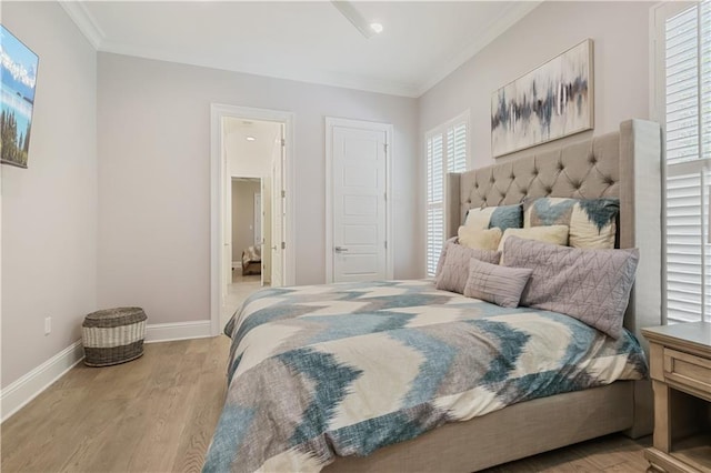 128 Juniper Ct, Mandeville, LA 70471 - bedroom with crown molding and wood finished floors
