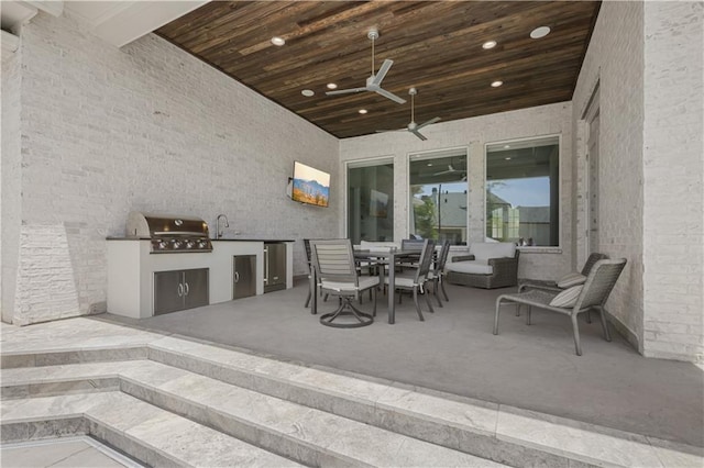 128 Juniper Ct, Mandeville, LA 70471 - view of patio with area for grilling, ceiling fan, and outdoor dining space