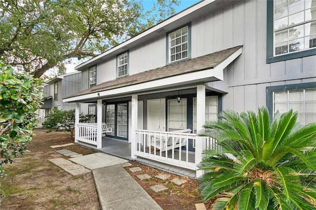 429 Cedarwood Dr Unit 429, Mandeville, LA 70471 - view of front of home with a porch and roof with shingles