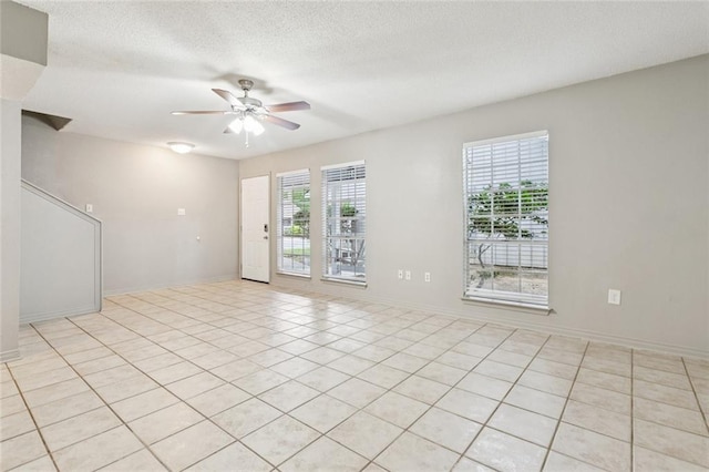 429 Cedarwood Dr Unit 429, Mandeville, LA 70471 - unfurnished room with ceiling fan, a textured ceiling, and light tile patterned flooring