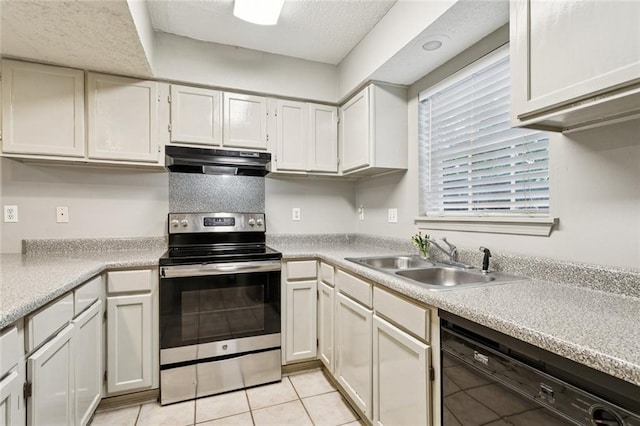 429 Cedarwood Dr Unit 429, Mandeville, LA 70471 - kitchen with stainless steel range with electric stovetop, under cabinet range hood, dishwasher, light countertops, and light tile patterned flooring
