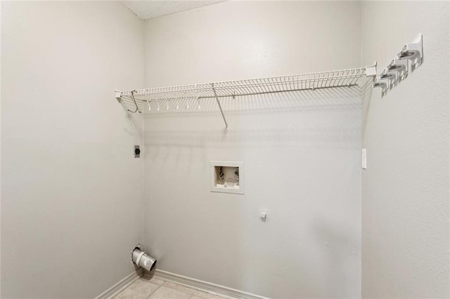 429 Cedarwood Dr Unit 429, Mandeville, LA 70471 - laundry area with hookup for an electric dryer, washer hookup, and light tile patterned flooring