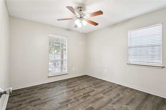 429 Cedarwood Dr Unit 429, Mandeville, LA 70471 - spare room with dark wood-style flooring, ceiling fan, and a textured ceiling