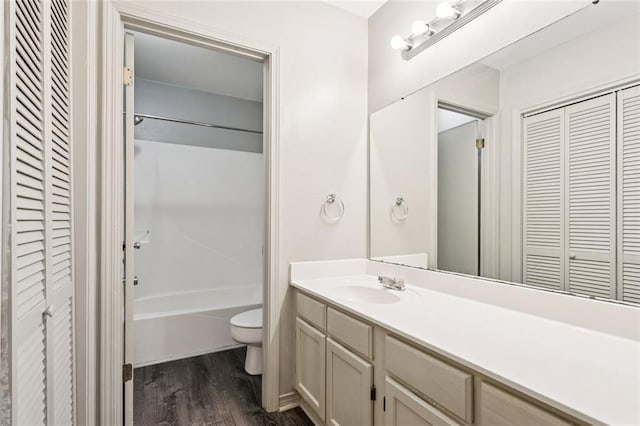 429 Cedarwood Dr Unit 429, Mandeville, LA 70471 - full bath with a closet, vanity, wood finished floors, and shower / bath combination