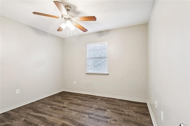 429 Cedarwood Dr Unit 429, Mandeville, LA 70471 - spare room with dark wood finished floors, a ceiling fan, and a textured ceiling
