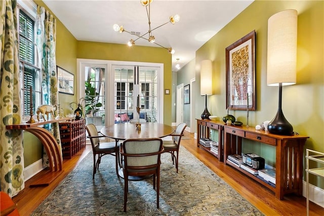 1808 N Rampart St, New Orleans, LA 70116 - dining area with wood finished floors and a chandelier