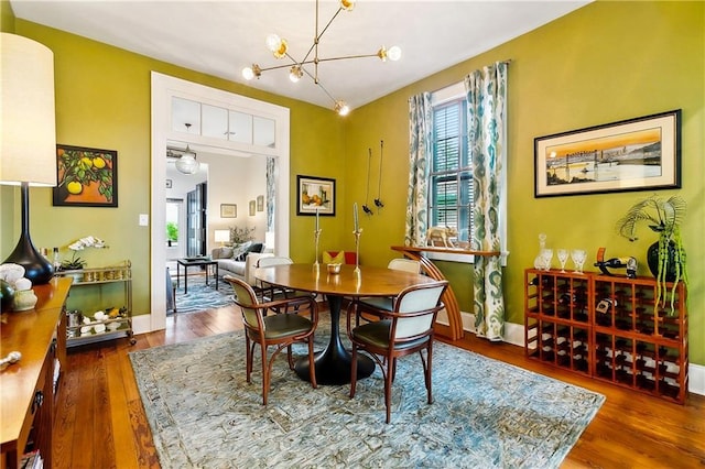 1808 N Rampart St, New Orleans, LA 70116 - dining space featuring a chandelier and wood finished floors