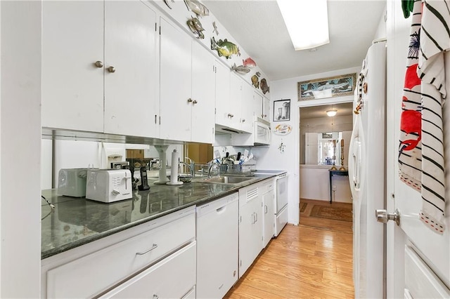 1550 2nd St Unit 4A, New Orleans, LA 70130 - kitchen featuring white appliances, white cabinetry, and light wood-type flooring