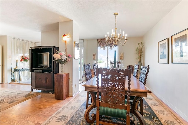 1550 2nd St Unit 4A, New Orleans, LA 70130 - dining area with a chandelier and wood finished floors
